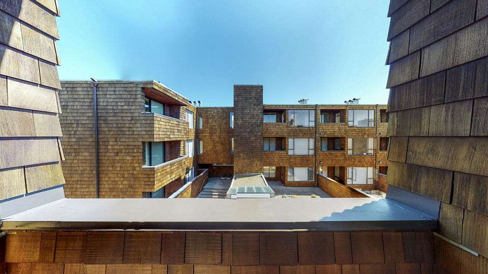 Spacious patio with modern furniture at 2133 Stockton Apartments, perfect for outdoor relaxation and city views