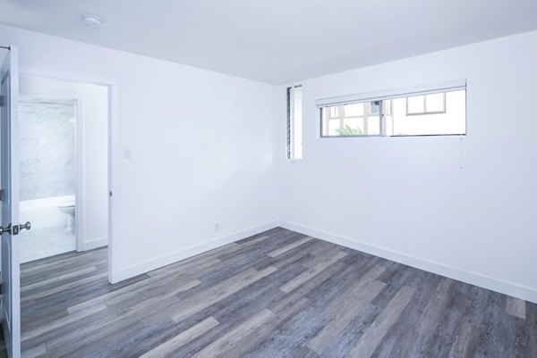 Cozy bedroom with modern decor at 230 Dolores Apartments