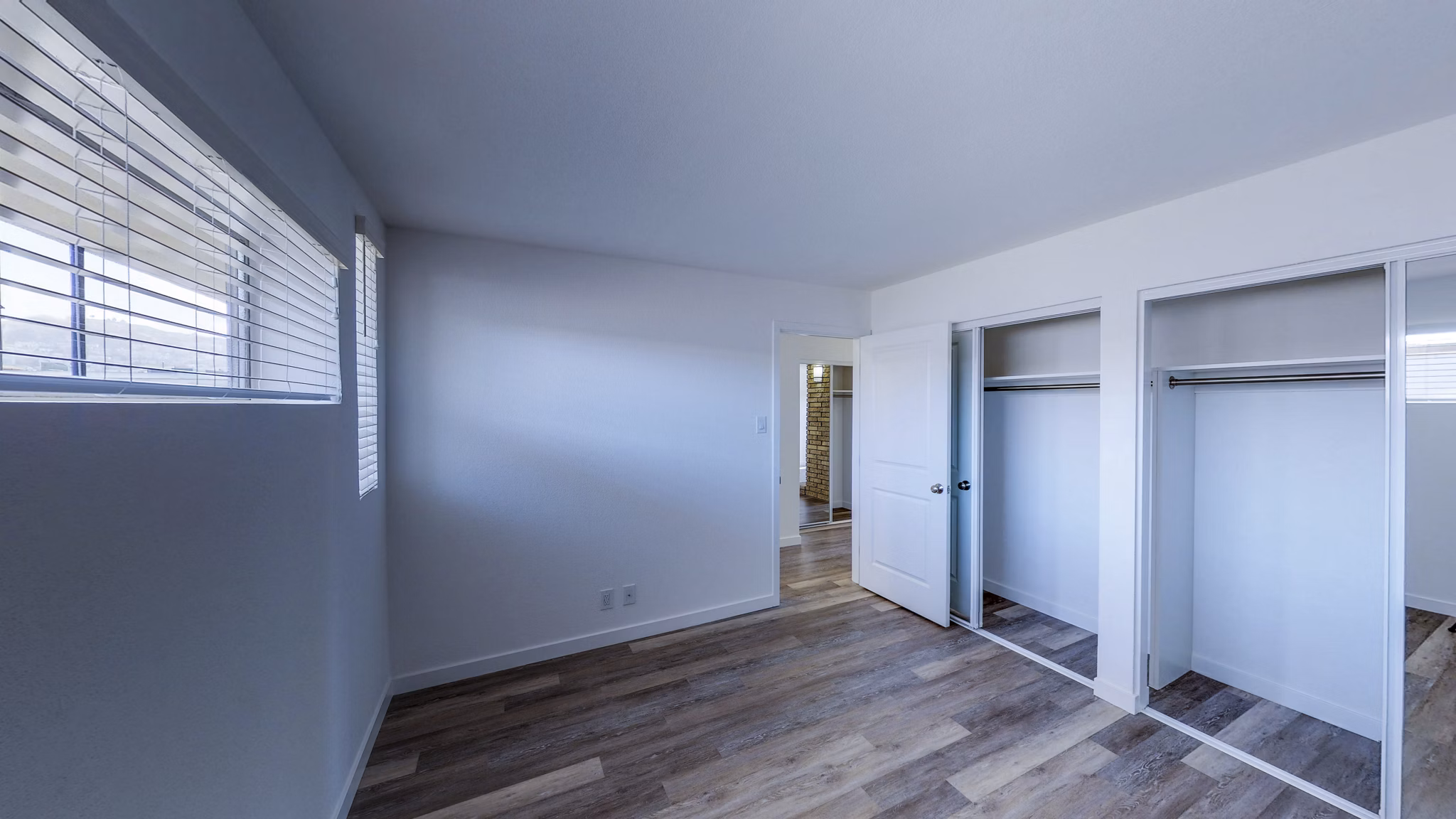 Cozy bedroom with modern decor in 230 Dolores Apartments, a Greystar luxury apartment community