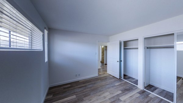 Cozy bedroom with modern decor in 230 Dolores Apartments, a Greystar luxury apartment community