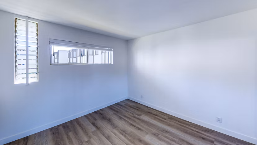 Bedroom featuring modern decor and large windows at 230 Dolores Apartments, a Greystar luxury community in an urban setting
