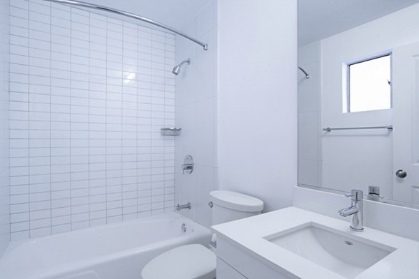 Bathroom featuring sleek fixtures and modern design at 230 Dolores Apartments in San Francisco