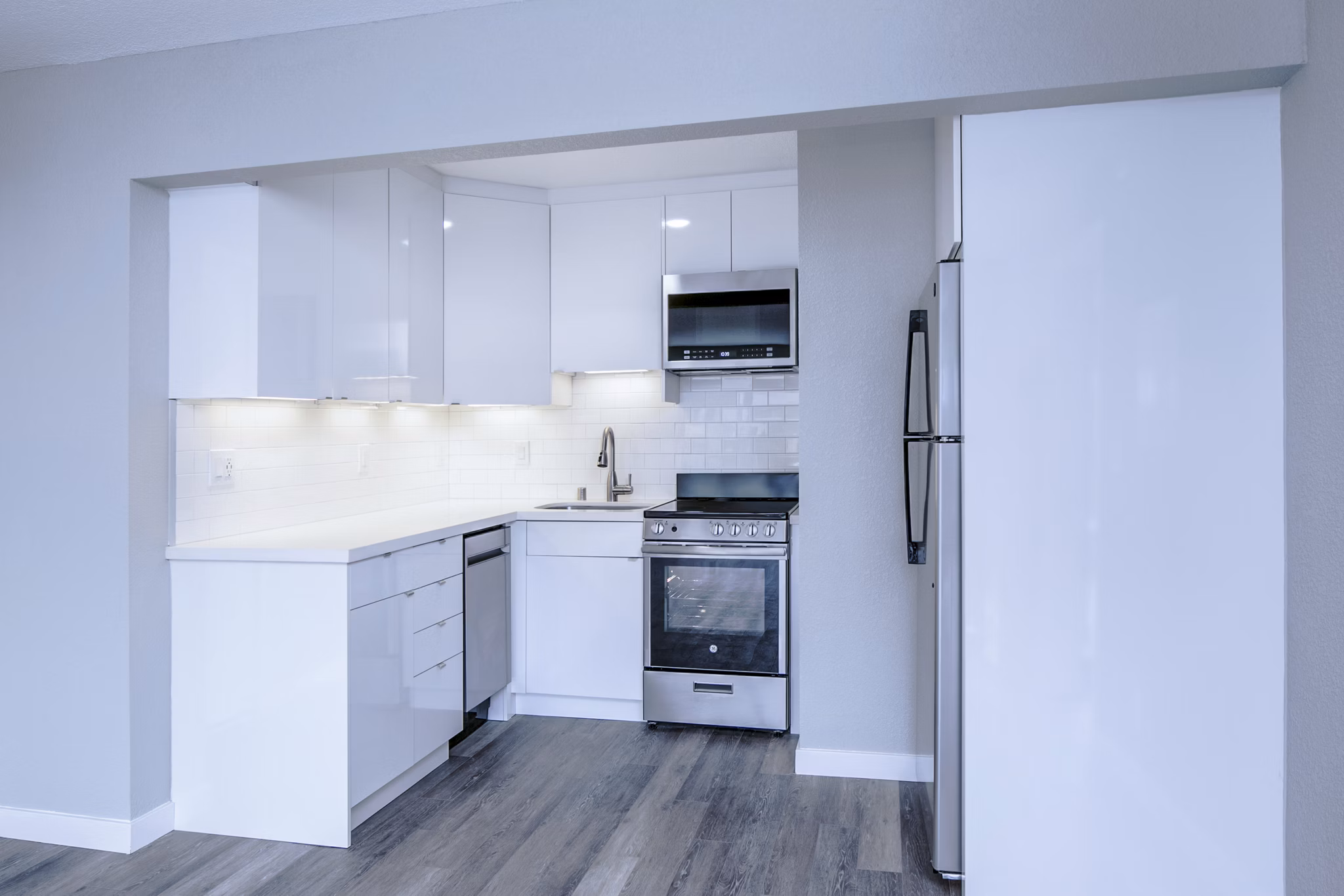 Modern kitchen with stainless steel appliances at 230 Dolores Apartments, luxury living by Greystar