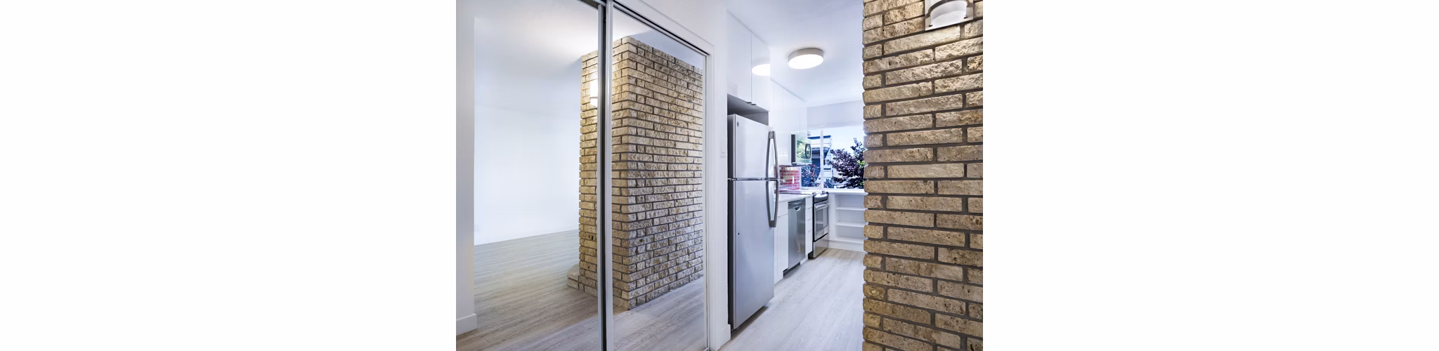 Modern kitchen with stainless steel appliances at 230 Dolores Apartments