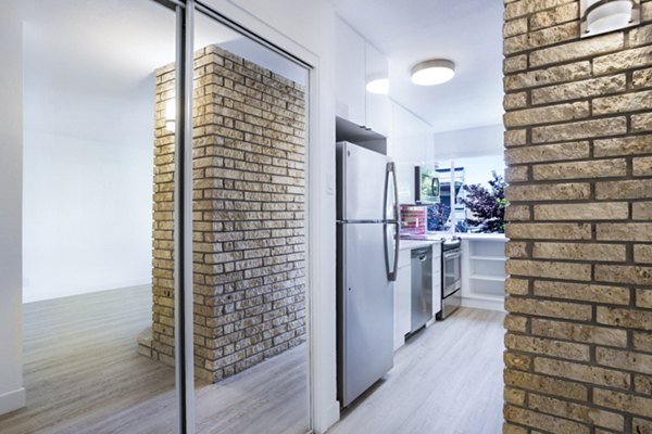 Modern kitchen with stainless steel appliances at 230 Dolores Apartments