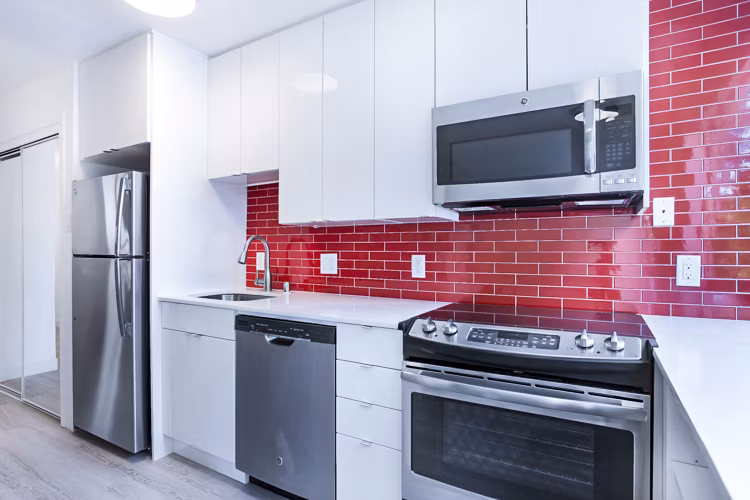 Modern kitchen featuring stainless steel appliances at 230 Dolores Apartments