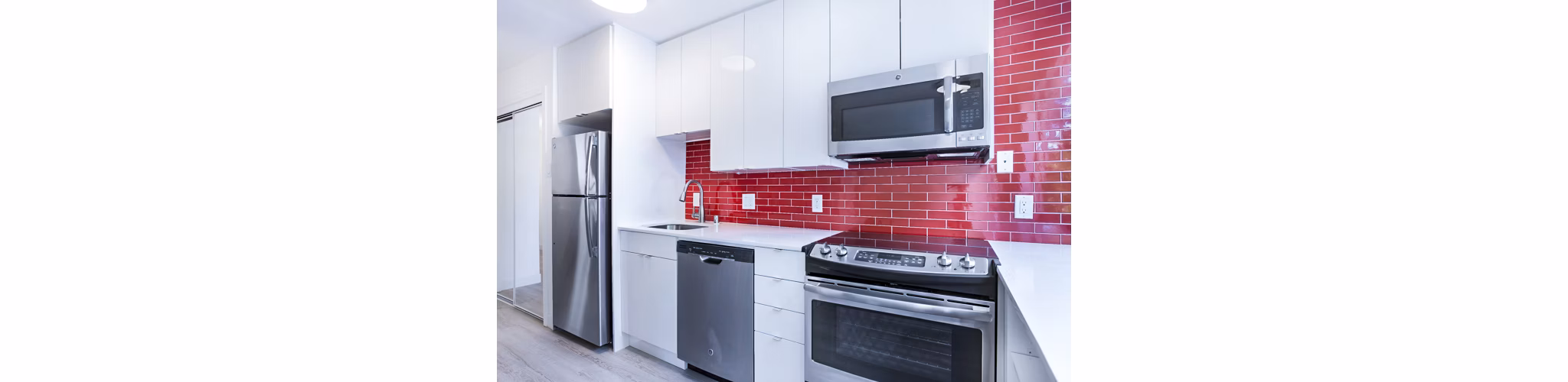 Modern kitchen featuring stainless steel appliances at 230 Dolores Apartments
