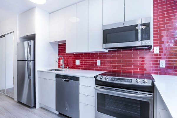 Modern kitchen featuring stainless steel appliances at 230 Dolores Apartments