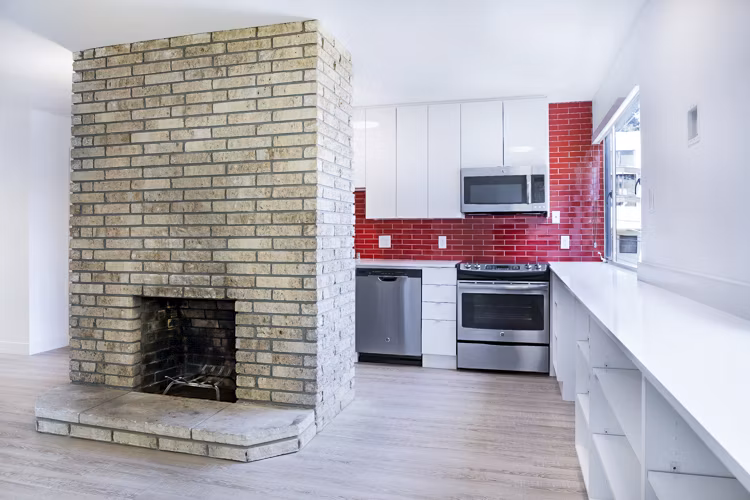 Modern kitchen with stainless steel appliances at 230 Dolores Apartments