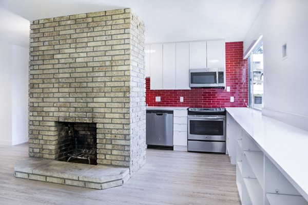 Modern kitchen with stainless steel appliances at 230 Dolores Apartments