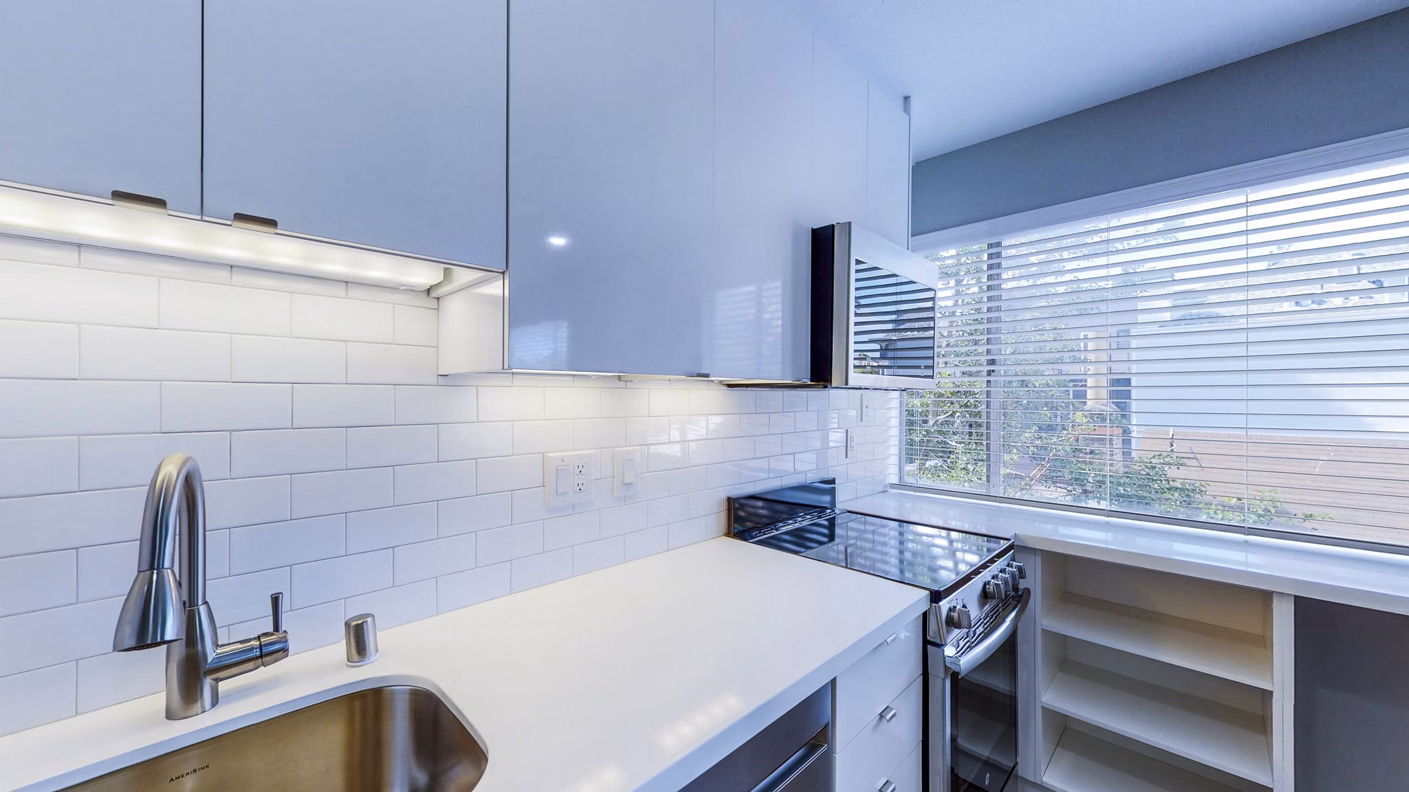 Kitchen featuring modern appliances and sleek countertops at 230 Dolores Apartments, a Greystar luxury property in downtown San Francisco