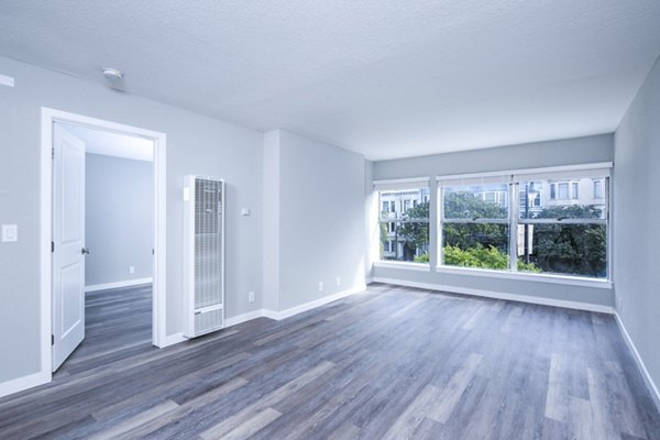 Spacious living room with modern decor and natural light at 230 Dolores Apartments
