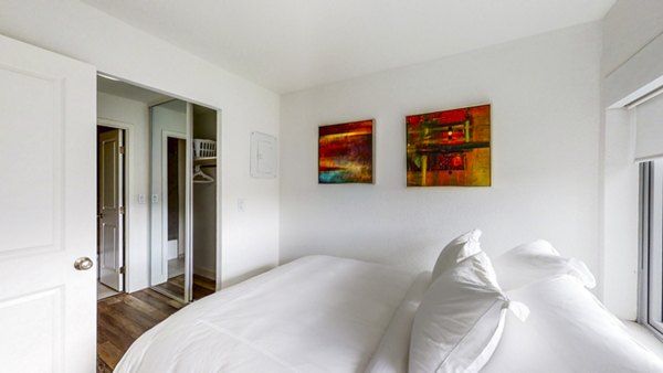 Bedroom featuring modern decor and large windows at Clay Park Tower Apartments in San Francisco