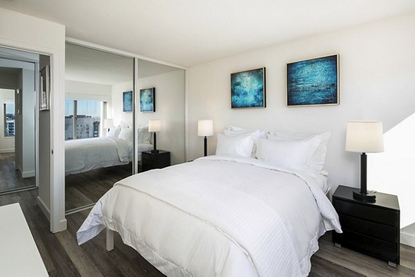 Cozy bedroom with city views in Clay Park Tower Apartments