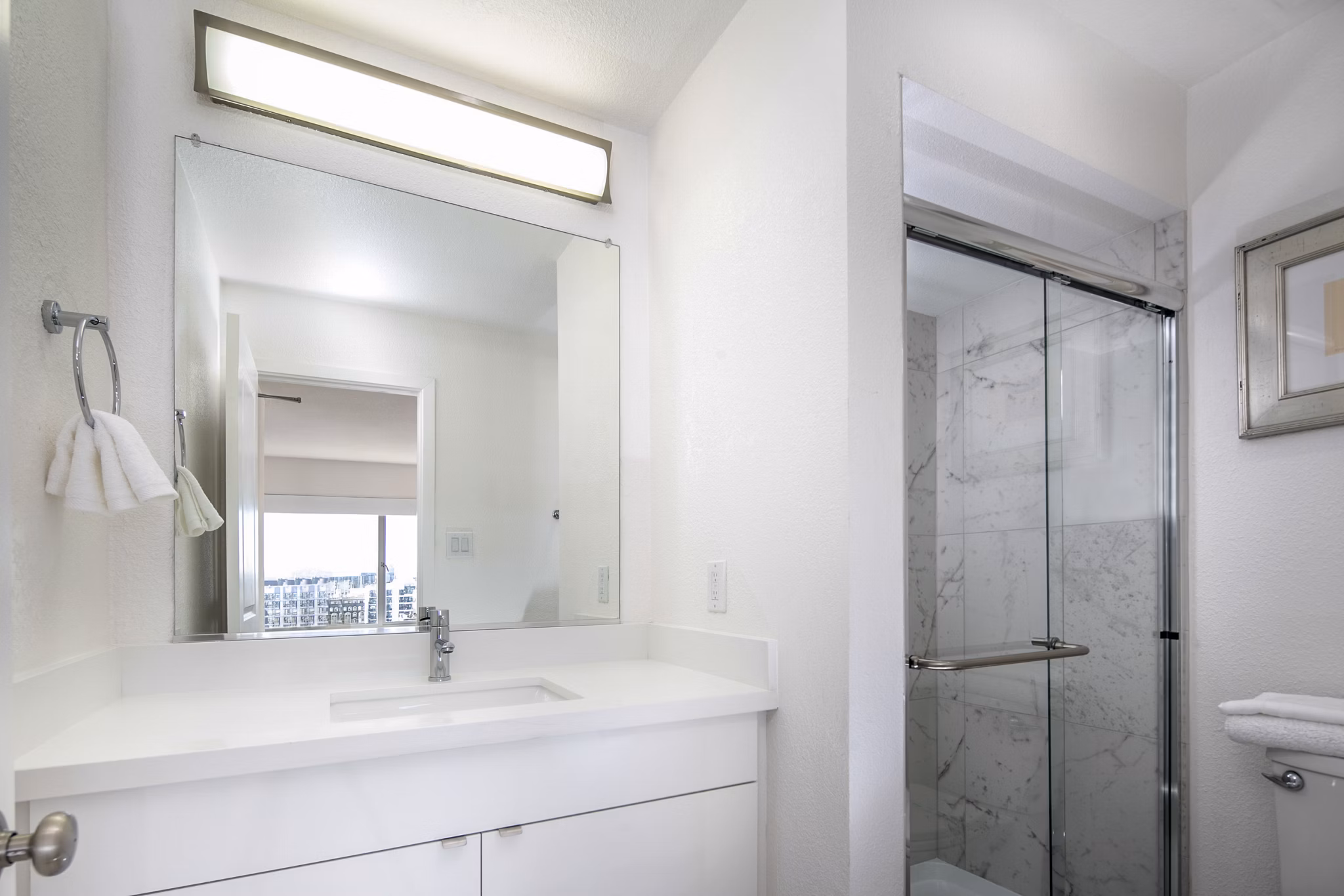 Bathroom with modern fixtures and neutral tones at Clay Park Tower Apartments