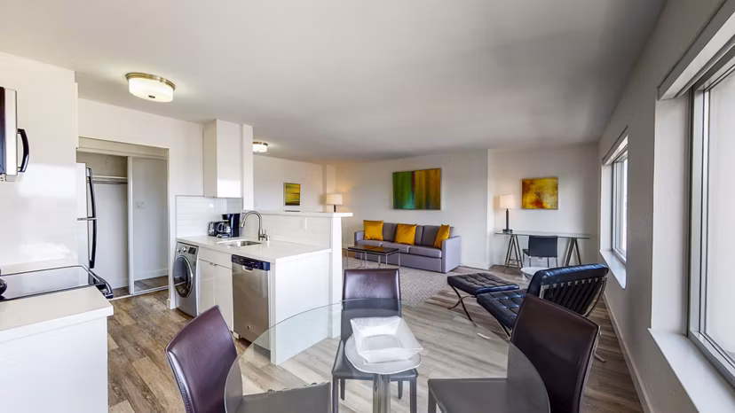 Dining area with modern furnishings and natural lighting at Clay Park Tower Apartments
