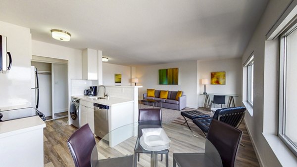 Dining area with modern furnishings and natural lighting at Clay Park Tower Apartments