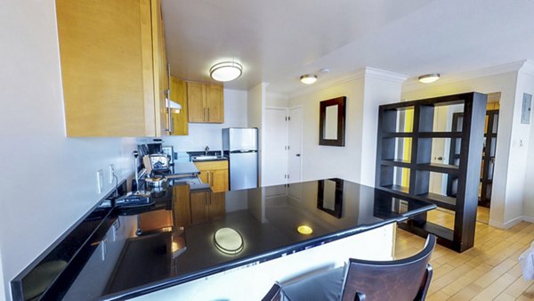 Dining room with elegant decor in Clay Park Tower Apartments, featuring modern furniture and a stylish ambiance for luxury living