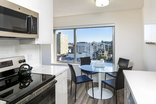 Dining room with modern dÃ©cor and elegant furnishings at Clay Park Tower Apartments