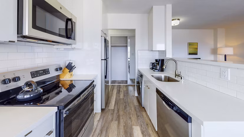 Modern kitchen with stainless steel appliances at Clay Park Tower Apartments