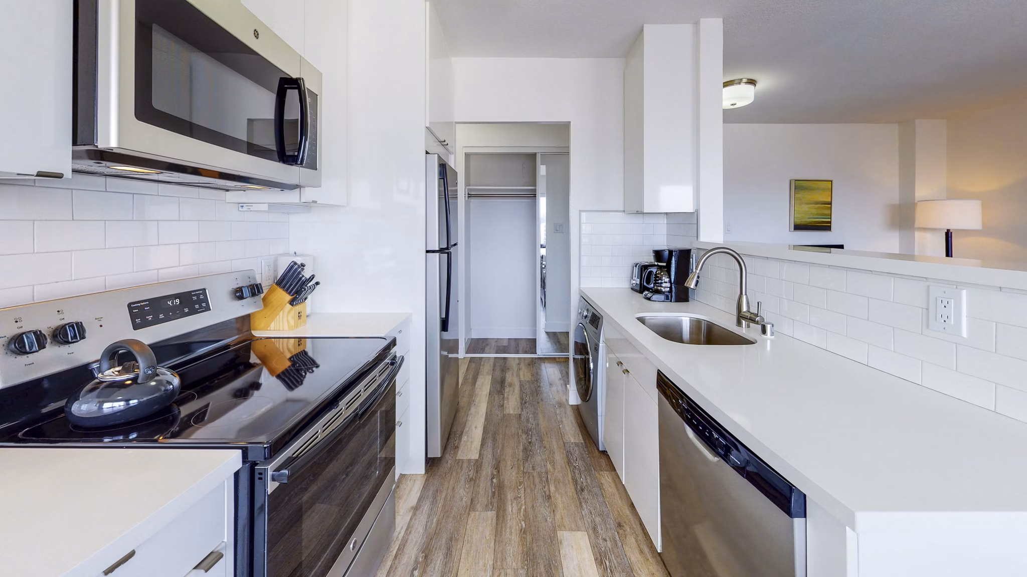 Modern kitchen with stainless steel appliances at Clay Park Tower Apartments