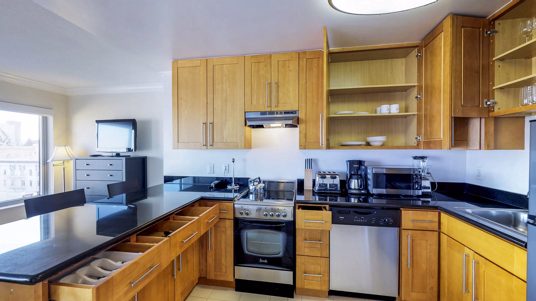 Sleek kitchen with modern appliances at Clay Park Tower Apartments, perfect for luxury living in a prime city location