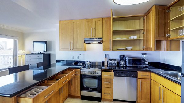 Sleek kitchen with modern appliances at Clay Park Tower Apartments, perfect for luxury living in a prime city location
