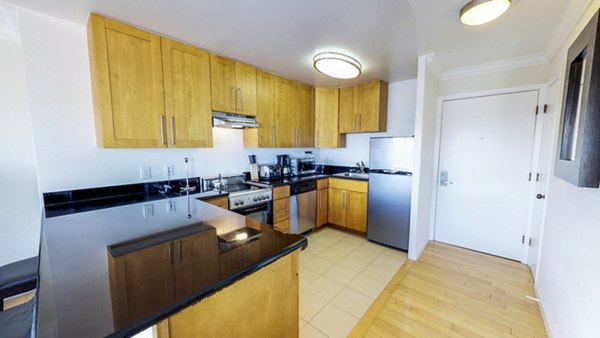 Modern kitchen with stainless steel appliances at Clay Park Tower Apartments