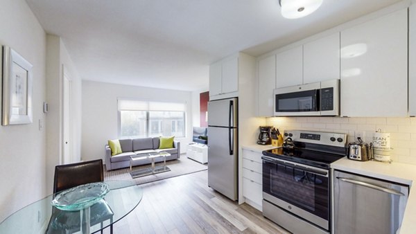 Modern kitchen with stainless steel appliances at Clay Park Tower Apartments