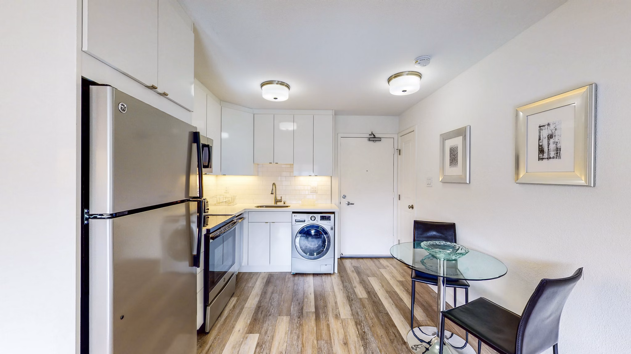 Kitchen with modern appliances and sleek countertops in Clay Park Tower Apartments
