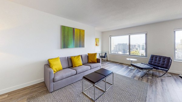 Clay Park Tower: Cozy living room with modern furnishings at luxury Greystar apartments