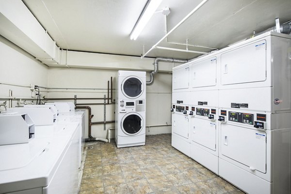 Laundry facility at Clay Park Tower: Modern laundry room equipped with washers and dryers in Greystar's luxury San Francisco apartments