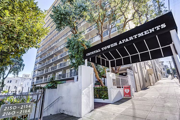 Crystal Tower Apartments: Luxury high-rise building showcasing modern architecture in an upscale urban setting