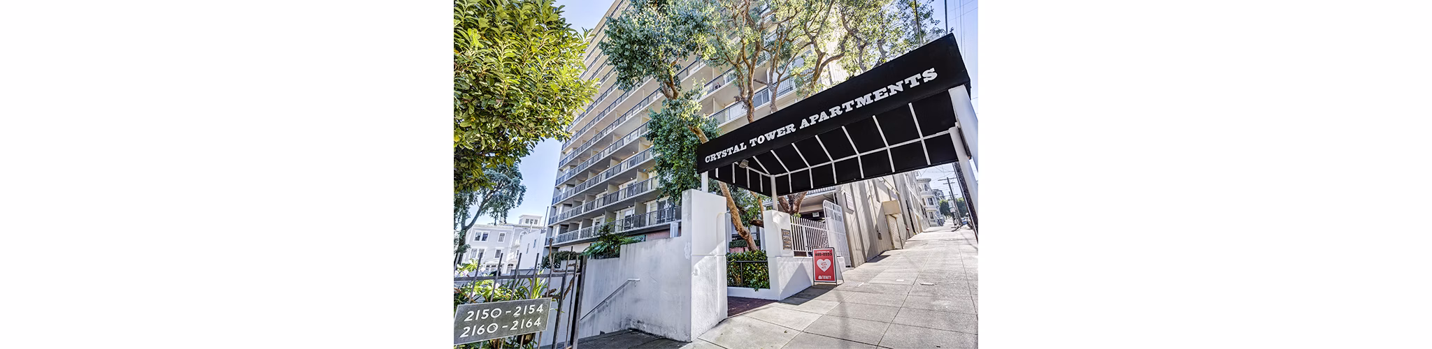 Crystal Tower Apartments: Luxury high-rise building showcasing modern architecture in an upscale urban setting