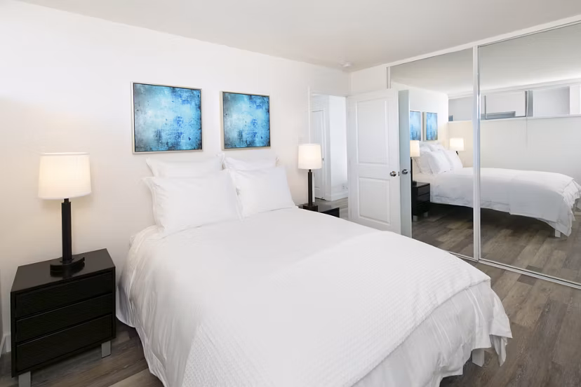 Cozy bedroom with sleek furnishings at Crystal Tower Apartments