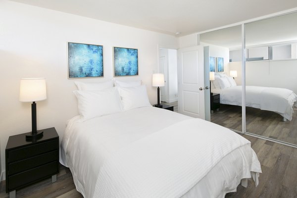 Cozy bedroom with sleek furnishings at Crystal Tower Apartments