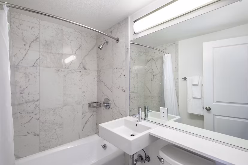 Crystal Tower Apartments: Elegant bathroom with modern fixtures and sleek design