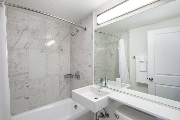 Crystal Tower Apartments: Elegant bathroom with modern fixtures and sleek design