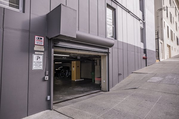 Covered parking garage at Crystal Tower Apartments providing convenient and secure vehicle storage for residents
