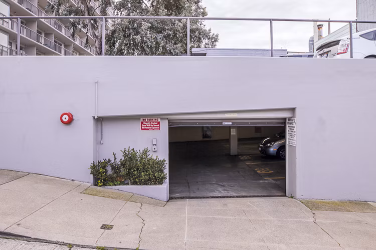 Covered parking garage at Crystal Tower Apartments offering secure vehicle storage