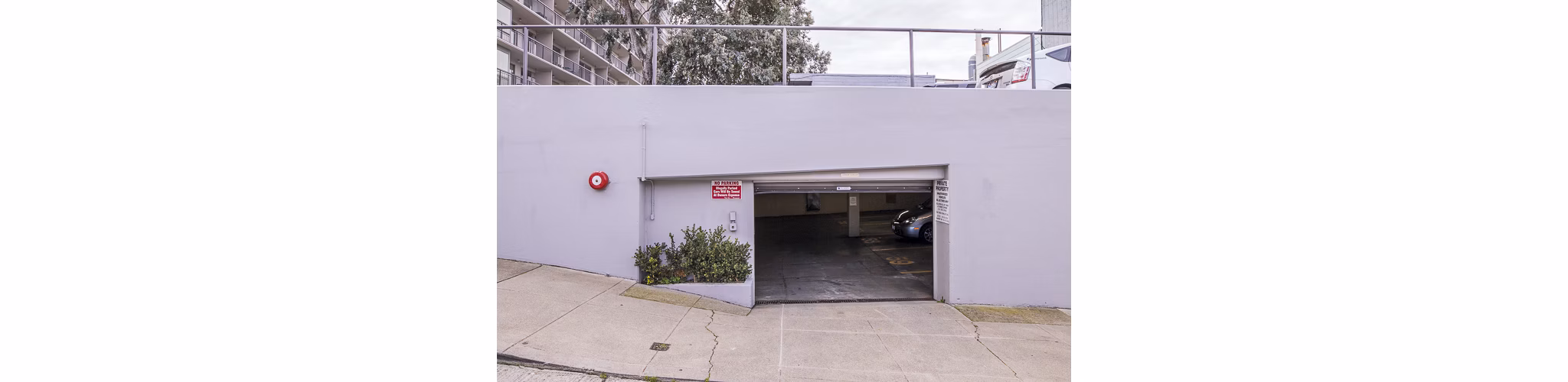 Covered parking garage at Crystal Tower Apartments offering secure vehicle storage