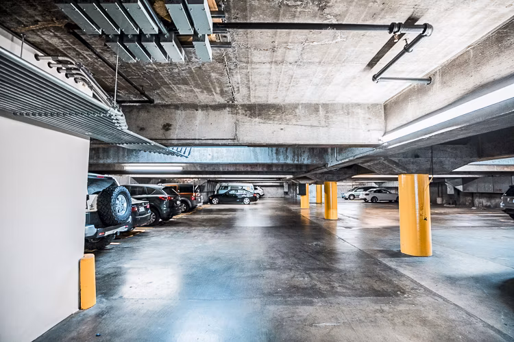 Garage with covered parking at Crystal Tower Apartments, featuring secure and convenient access for residents' vehicles