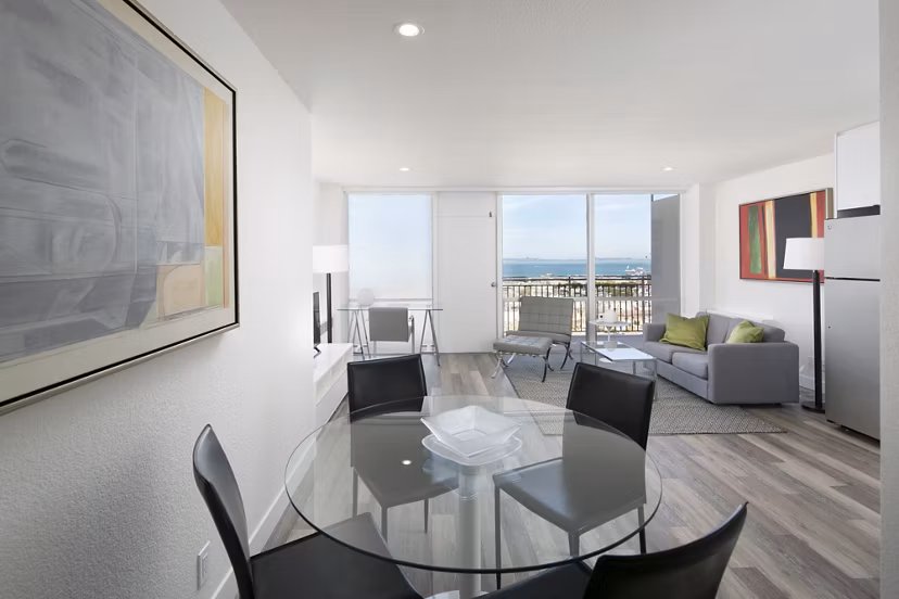 Dining room featuring modern furniture and elegant lighting in Crystal Tower Apartments