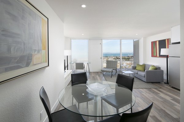 Dining room featuring modern furniture and elegant lighting in Crystal Tower Apartments