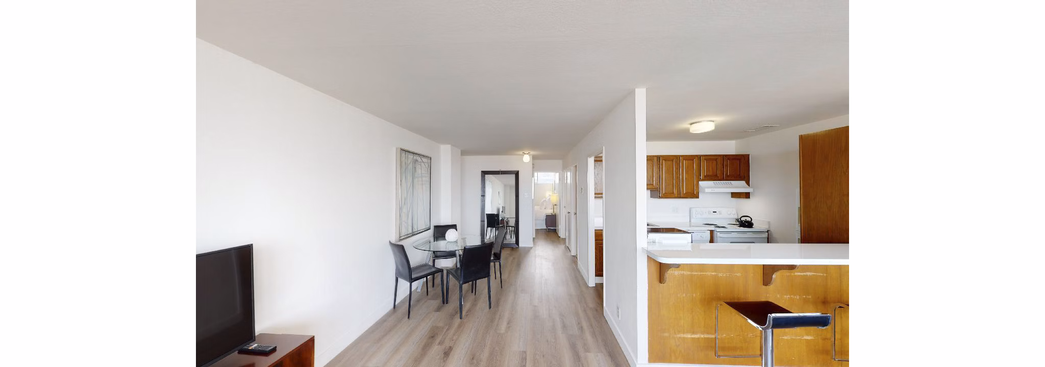 Dining area with elegant lighting and modern furnishings in Crystal Tower Apartments