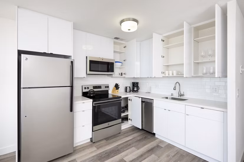 Modern kitchen with stainless steel appliances at Crystal Tower Apartments
