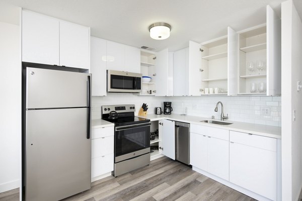 Modern kitchen with stainless steel appliances at Crystal Tower Apartments