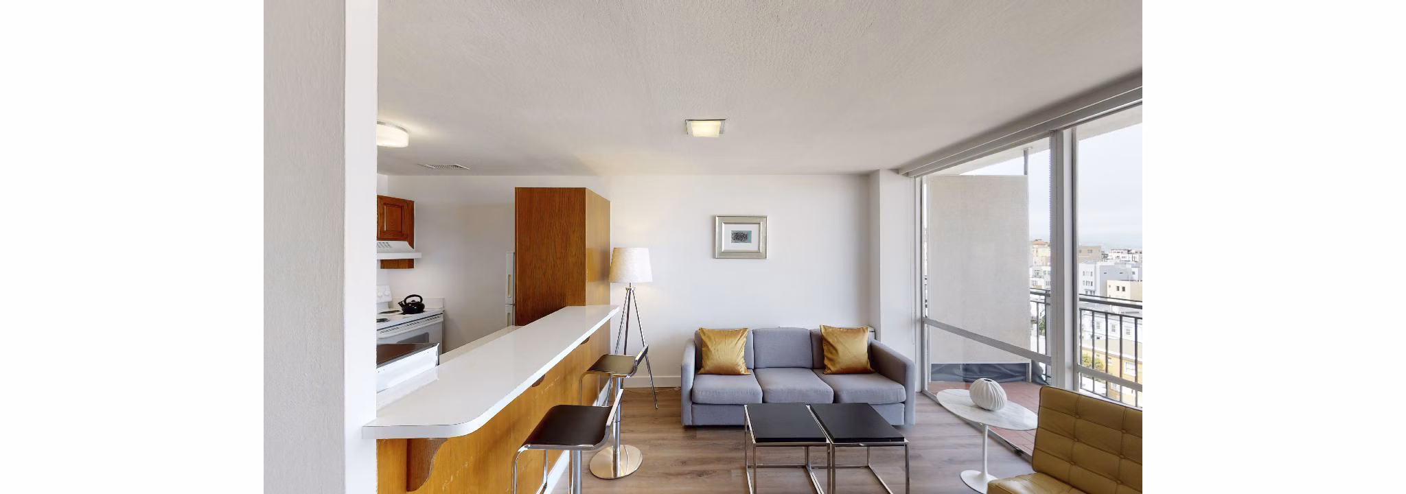Spacious living room with modern decor and large windows at Crystal Tower Apartments