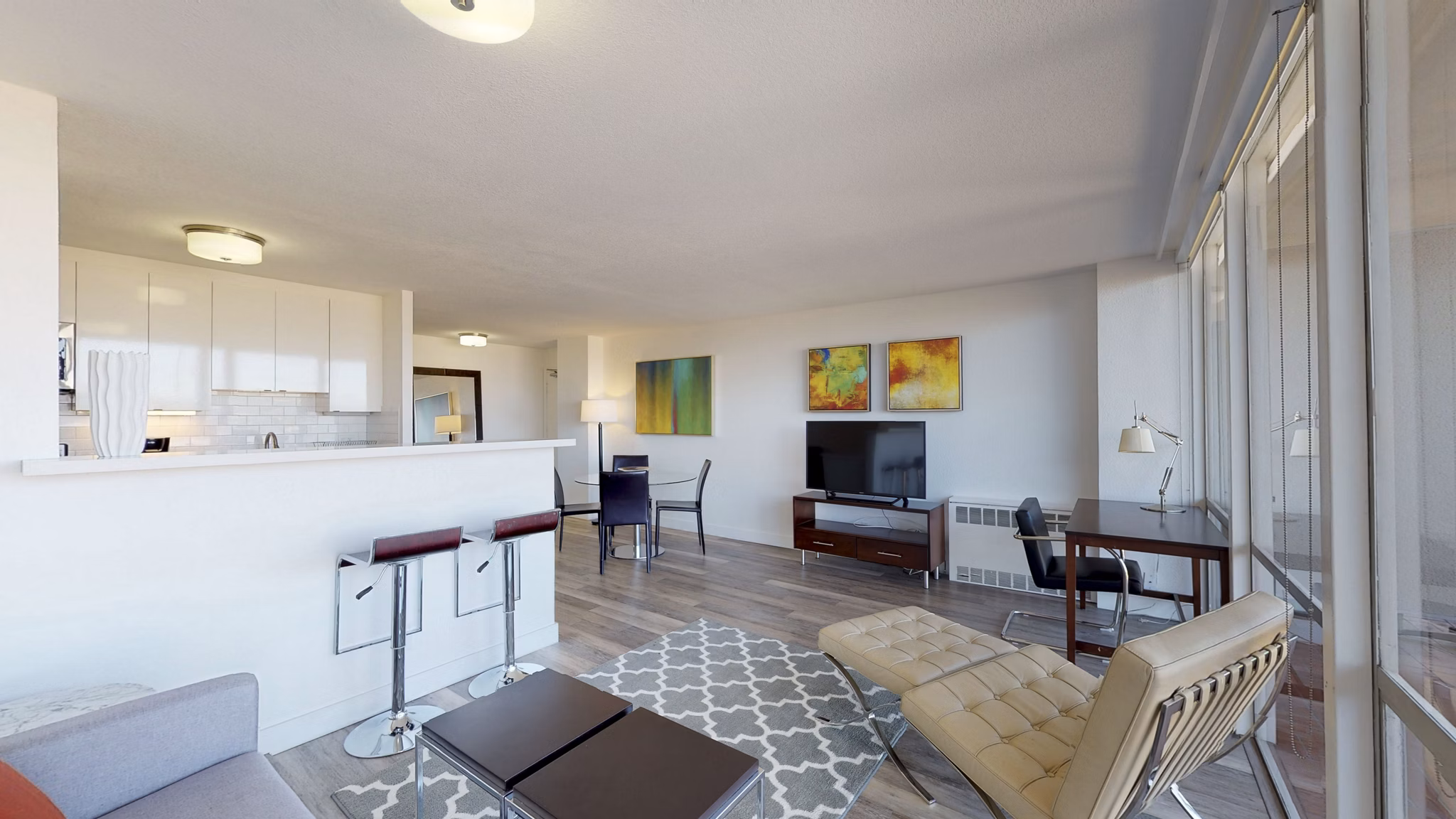 Spacious living room with modern decor at Crystal Tower Apartments