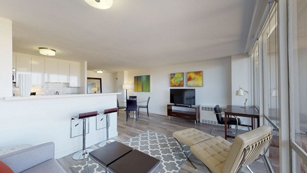 Spacious living room with modern decor at Crystal Tower Apartments